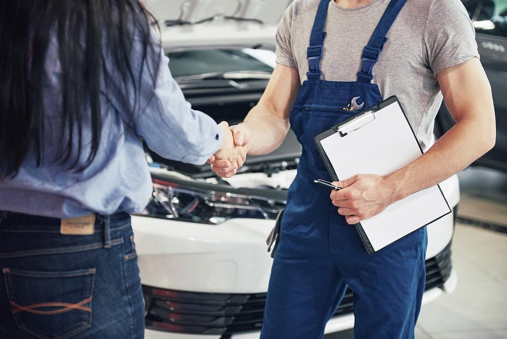 Safety Inspection mechanic shaking customer's hand